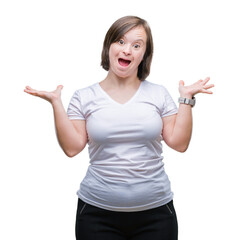 Poster - Young adult woman with down syndrome over isolated background celebrating crazy and amazed for success with arms raised and open eyes screaming excited. Winner concept