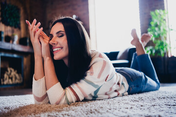 Poster - Photo of sweet good mood lady dressed striped jumper lying floor having rest indoors house room