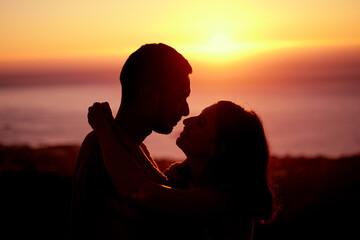 Poster - Sunset, sky and silhouette of couple with hug, embrace and orange sunshine on romantic outdoor date. Love, man and woman with care, nature and support for evening adventure, holiday and relationship