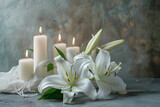 Fototapeta  - Peaceful condolence background with white lilies and lit candles on a textured grey surface, symbolizing sympathy and remembrance