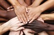 © StockUp - A powerful image of many different hands joined together in the center representing unity, diversity, teamwork, and collaboration
