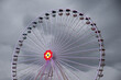 Ferris wheel with colored lights on the Prater in Vienna. dark clouds in the background