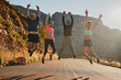 © peopleimages.com - Road, fitness and jump to celebrate, friends and nature of mountain, portrait and happiness for wellness. Athlete, men and women in air, excited and exercise in summer, sports and outdoor together