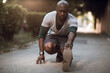 © Geber86 - Active young black man stretching on the street