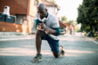 © Geber86 - Active young black man stretching on the street