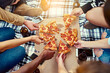 © peopleimages.com - Hands, friends and pizza outdoor for picnic while hanging out, chilling and bonding together with drinks. Above, hungry and people with fast food in park for eating lunch, brunch and dinner for peace