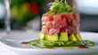 Stacked Tuna Tower with Avocado Base on White Plate: A Fresh and Healthy Japanese-style Raw Fish
