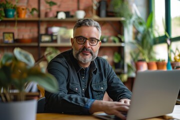 Poster - A man in a suit sitting at a table with a laptop, engaged in a video call discussing company matters, A high-powered CEO on a video call discussing company growth