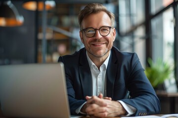 Poster - A man, highpowered CEO, sits at a table in front of a laptop computer, actively engaged in a video call discussing company matters, A high-powered CEO on a video call discussing company growth
