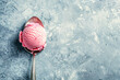 strawberry ice cream scoop on gray background. Top view. Copy space