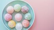 An assortment of colorful mochi arranged in a circular pattern on a pastel blue plate, perfect for decorative dessert presentations or marketing for specialty confectioneries.