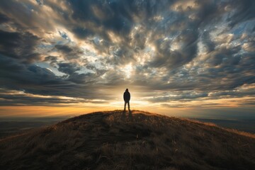 Poster - A person is standing on top of a hill, overlooking the landscape, under a cloudy sky, A lone figure standing on a hilltop, watching the evening descend with a sense of peace and contemplation