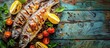 photo of dorado fish on board delicious grilled with lime, red onion and spices on wooden background