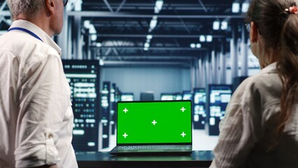 Poster - system administrators looking around high tech data center, using mockup laptop to crosscheck disast