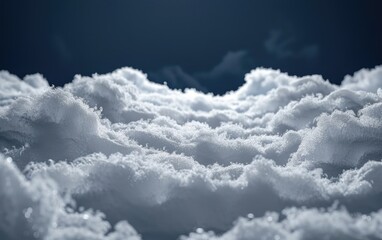 A long, fluffy stretch of white snow on a solid dark background.