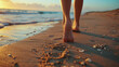 Close up of female legs walking barefoot on sandy beach at sunset. Generative AI