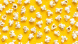 Seamless popcorn repeat tile pattern on yellow background. A yellow background with a bunch of white popcorn on it. The popcorn is scattered all over the background.