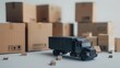 © millionaire - A black toy delivery truck next to cardboard boxes, on a white background, concept of logistics and moving