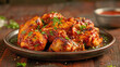 © Sviatlana - Indian cuisine. A plate of chicken tikka masala with a side of sauce
