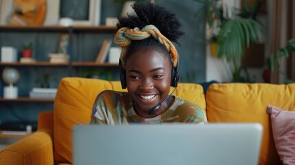 Canvas Print - Happy African American female student having video call while e-learning at home