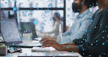 Wall Mural - Diverse group of friends working on laptops, surrounded by graphic bubbles