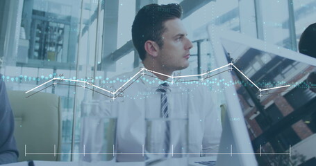 Poster - Image of multiple graphs over diverse manager explaining strategy to coworkers in office