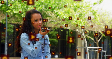 Poster - Image of icons connected with lines over biracial woman talking on speaker of cellphone