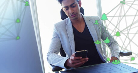 Poster - Image of connected icons globes over biracial man scrolling on smartphone at office