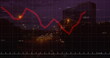 Image of financial graphs and data over cityscape at night