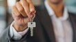 © FrankBoston - Woman realtor offering the keys of a new house to the client
