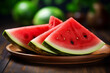 Pieces of watermelon on wooden plate.