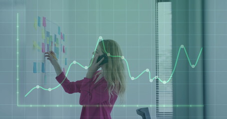 Poster - Image of financial data processing over businessman using tablet
