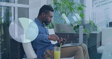 Poster - An African American young professional, wearing denim jacket, focusing on screens