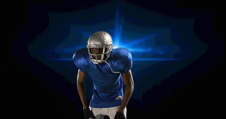 Poster - Image of american football player putting helmet on on blue glowing background