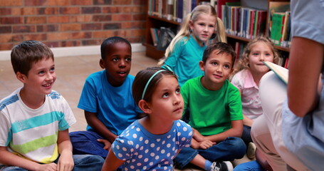 Poster - Diverse students in colorful shirts listen to a teacher at school