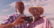 Image of joy over happy diverse senior couple taking selfie on beach