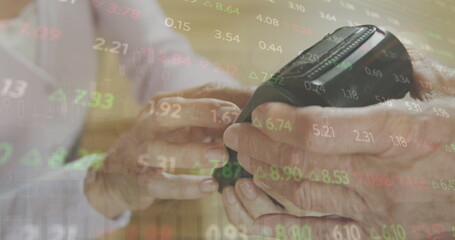 Poster - Image of stock market data processing over mid section of senior woman using a card machine