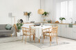 © Pixel-Shot - Interior of kitchen with white counters, grey sofa and dining table