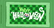 Image of happy halloween and cat over green checked background