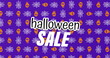 Image of halloween sale over skulls and spiders web on purple background