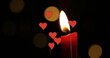 Image of hearts over spots and candle