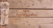 Image of happy thanksgiving day text over cutlery