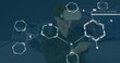 Image of chemical equations over caucasian man using vr headset