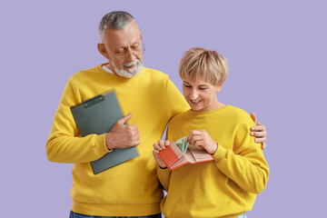 Sticker - Mature couple with money and clipboard on lilac background