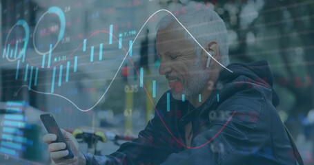 Poster - Image of trading board, senior caucasian man wearing headphones and scrolling on cellphone