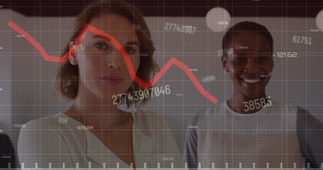 Wall Mural - Image of changing numbers and red graph over portrait of two diverse women smiling at office