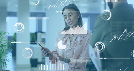 Poster - Image of data processing over african american woman discussing with male colleague at office