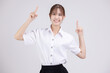 Pretty Asian woman in university student uniform over isolated white background pointing finger up.