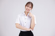 Pretty Asian woman in university student uniform over isolated white background pointing finger to teeth.