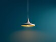 A modern pendant light hanging from a blue wall Generative AI.